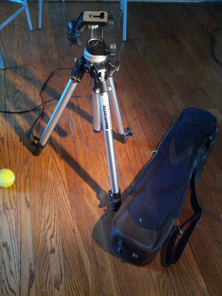 Vintage tripod with its hipster carrying bag